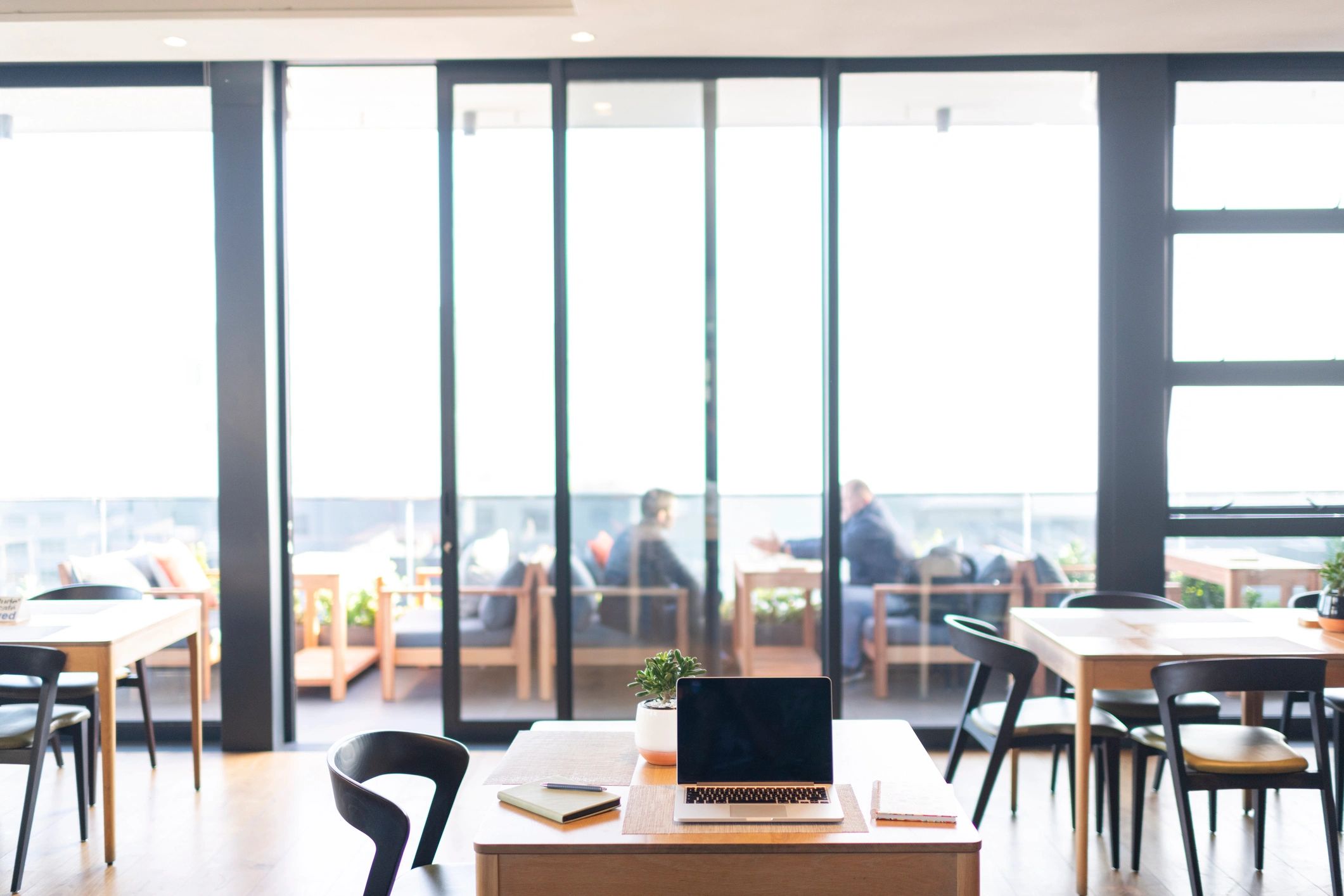 Laptop and notebook workspace for monthly bookkeeping